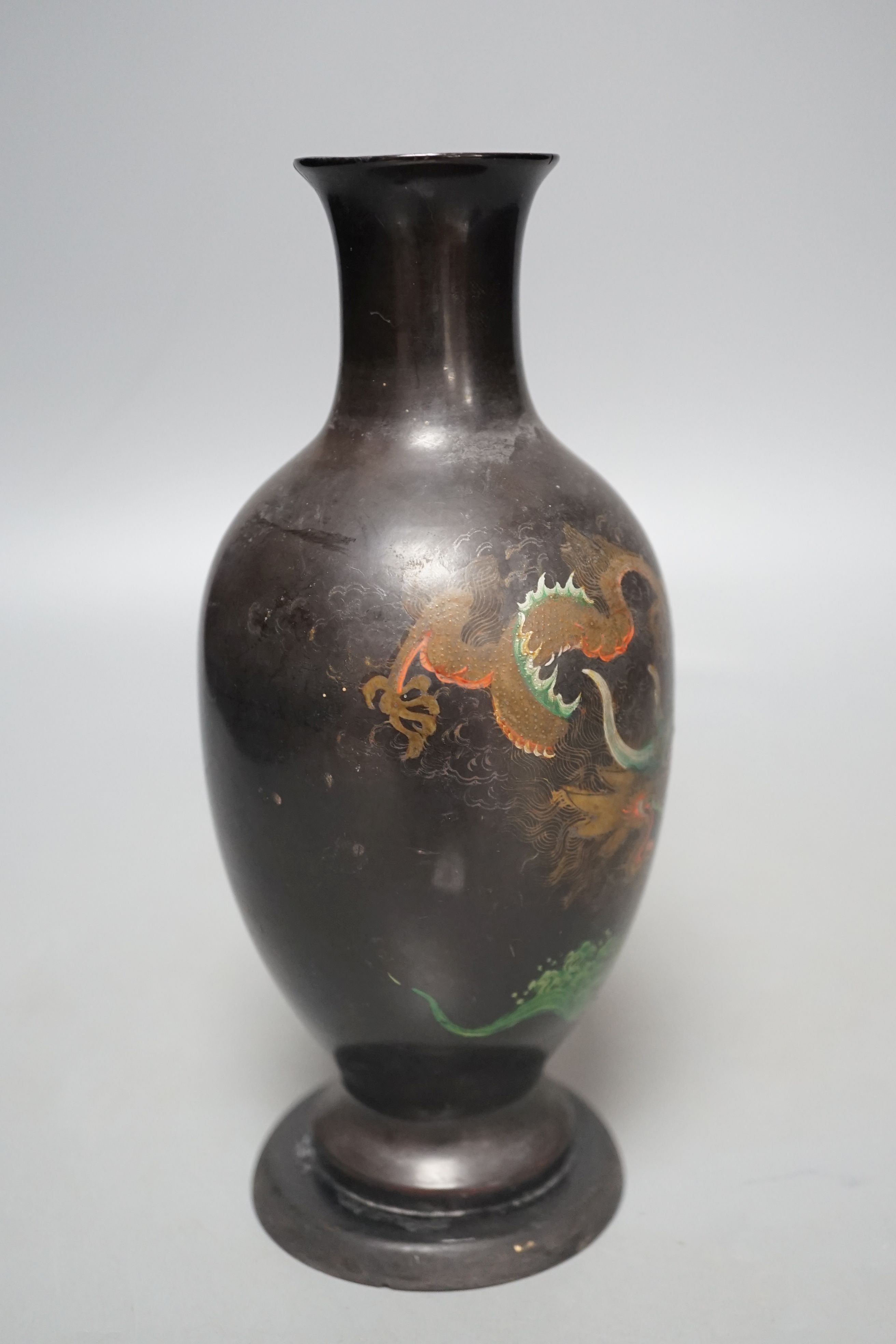 A Chinese Fuzhou lacquer papier-mâché dragon design vase, 20.5 cms high.